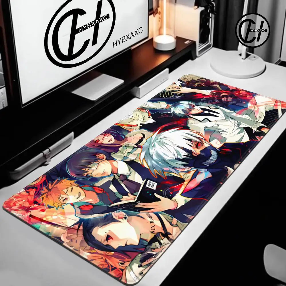 Colorful anime-style mouse pad on a desk with a computer monitor displaying 'HYBAXG'.