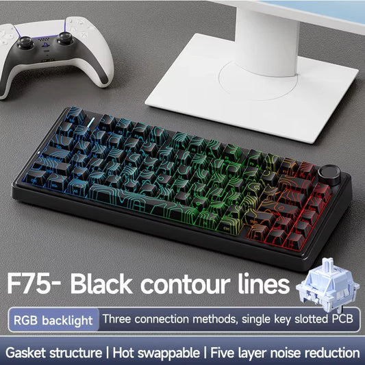 Mechanical keyboard with RGB backlighting on a desk with a monitor and gaming controller.