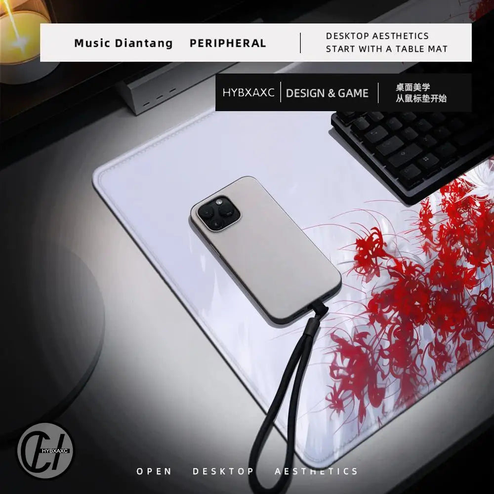 Phone case with strap on a desk mat with red design, keyboard in the background