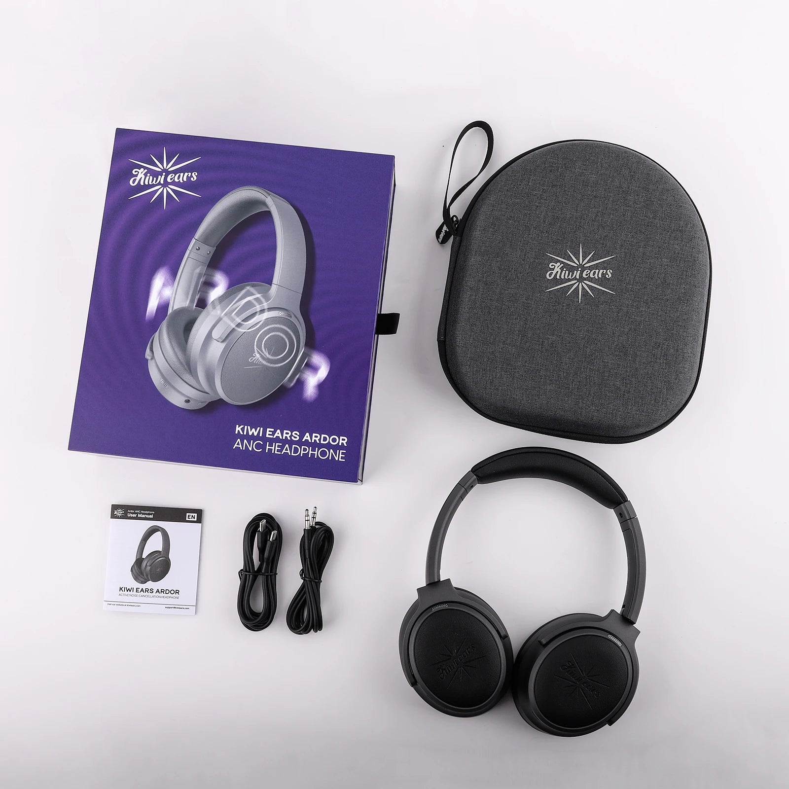 Kiwi Ears headphone set with packaging, case, and accessories on a white background