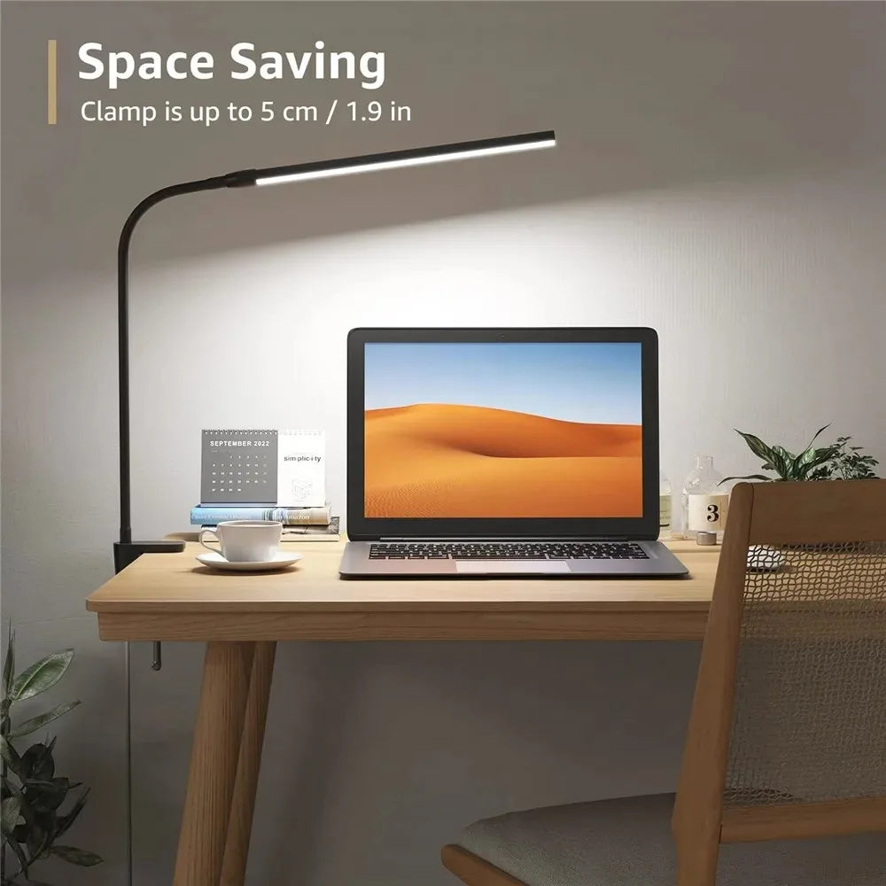 Desk setup with a clamp lamp and laptop, featuring text 'Space Saving'.