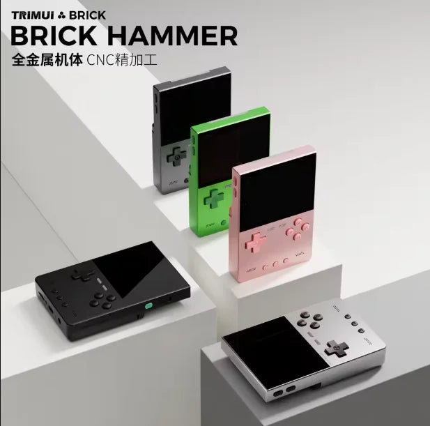 Five handheld gaming consoles in different colors on a gray surface with 'TRIMUI & BRICK' branding.